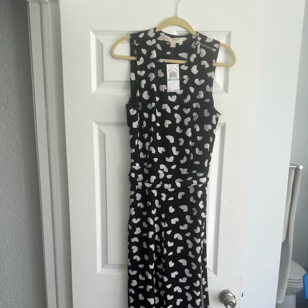Michael Kors mid-length jump suit. Side zipper, belt, pockets. Size 8. New
